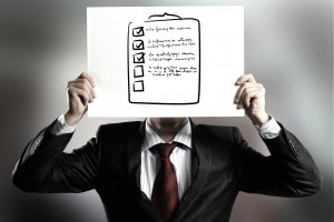 http://www.dreamstime.com/stock-photo-anonymous-interview-businessman-hiding-his-face-behind-paper-sheet-sketches-image43761790